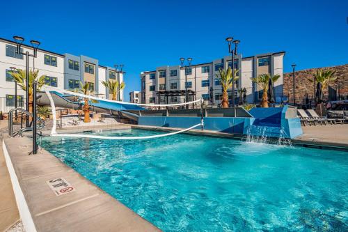 a swimming pool with a water slide in a resort at Coral Springs A8 3 Bedrooms BBQ Grill, Cable TV, 2 Private Fireplaces, Soaker Bathtub Resort Pool in Hurricane
