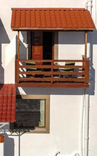 a model of a house with a porch at Mistral-Patmos in Patmos