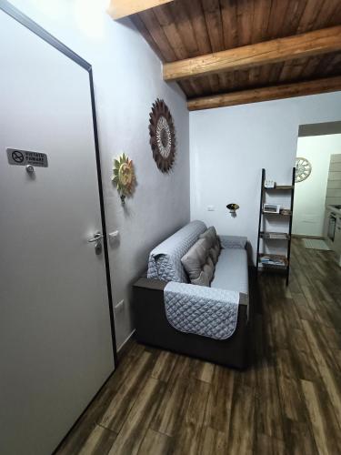 a room with a bed and a ladder in it at Bed and breakfast Raggio di Sole in Iglesias