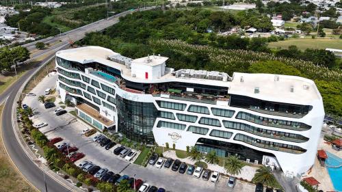 an aerial view of a large building with a parking lot at Aloft Ponce Hotel & Casino in Ponce