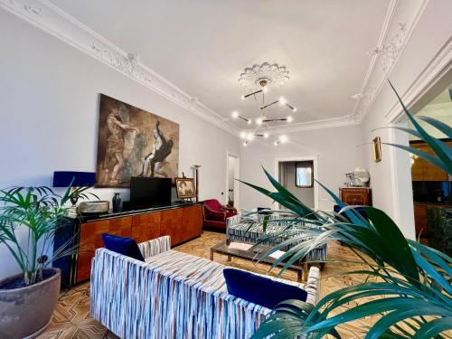 a living room with a couch and a tv at Chopin Boutique in Warsaw