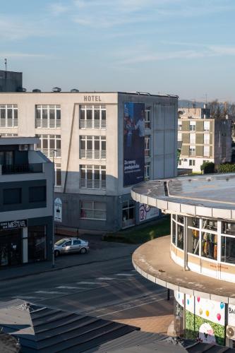 a view of a building with a parking lot at Studio apartman Barbara in Virovitica
