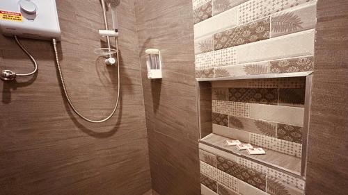 a bathroom with a shower with shoes on a shelf at Villa Palmeras - 4 Bedrooms AC Modern Luxury Villa in Phoenix