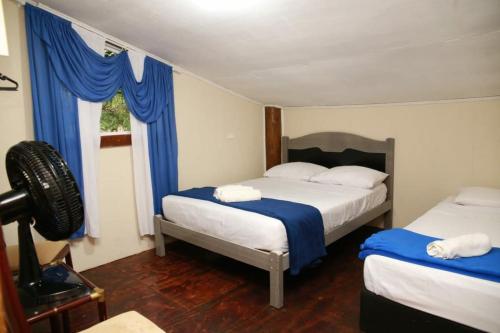 Postel nebo postele na pokoji v ubytování Sobrado Verde da Ale e do Thiago Ilha do Mel Encantadas