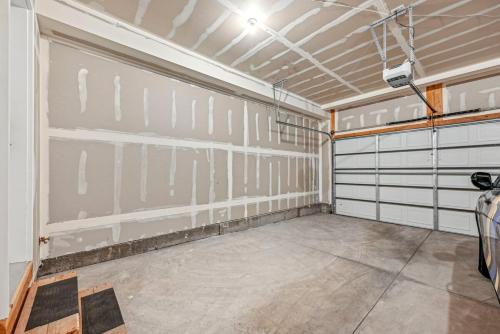 a garage with white garage doors in a room at Townhouse ski spot! in Keetley Junction