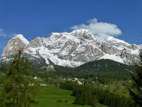 a mountain range with trees and mountains at Hotel Villa Gaia in Cortina dʼAmpezzo