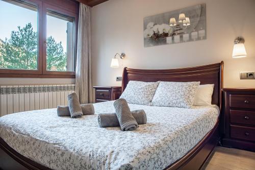Escapada Natural con Parking, Vistas y Jardínにあるベッド