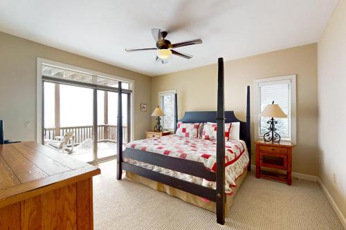 a bedroom with a bed and a ceiling fan at Reserve 02-D in Sugar Mountain