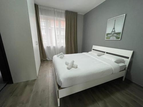 Rúm í herbergi á Cozy City Escape