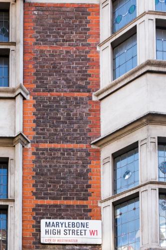 a brick building with a sign on it at The Z Hotel Gloucester Place in London