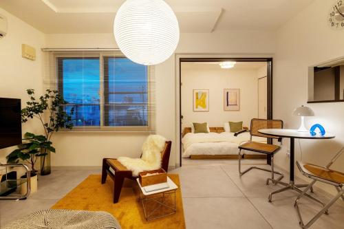 Postel nebo postele na pokoji v ubytování Cozy Stay Sapporo East