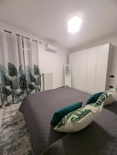 a bedroom with a large bed with pillows on it at Forn'otto Apartment in Quaglietta