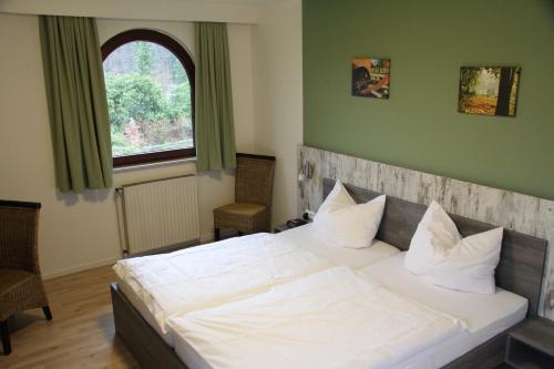 Postel nebo postele na pokoji v ubytování Meyerhof Heiligenrode