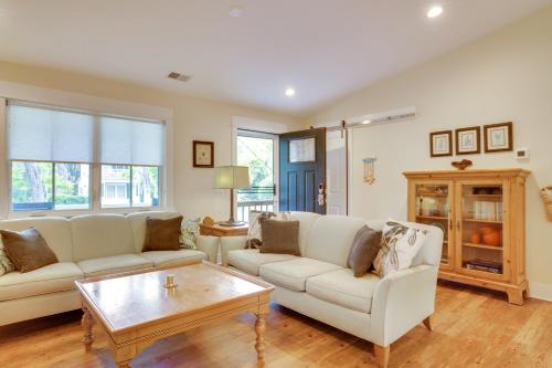 a living room with two white couches and a coffee table at Home in Beaufort Historic District with Private Yard in Beaufort
