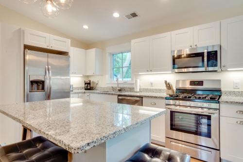 a kitchen with white cabinets and a granite counter top at Home in Beaufort Historic District with Private Yard in Beaufort