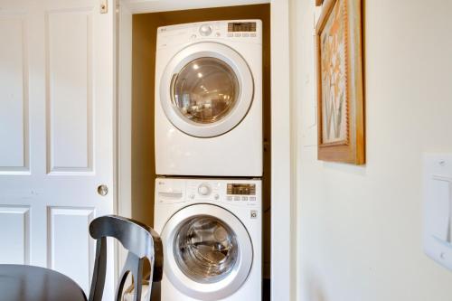 two washer and dryer machines in a room at Home in Beaufort Historic District with Private Yard in Beaufort