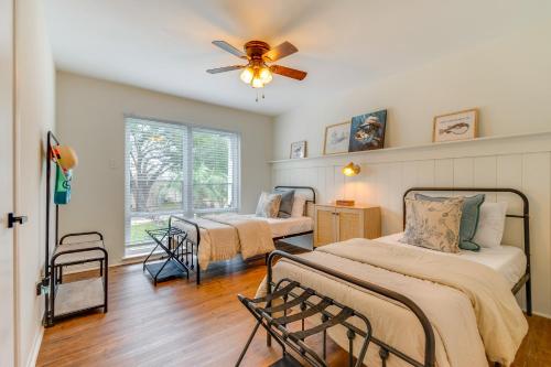 a bedroom with two beds and a ceiling fan at Walk to Lake Conroe Family-Friendly Getaway! in Montgomery