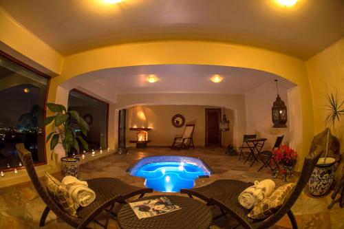 a swimming pool in the middle of a living room at Porton del Cielo in Pátzcuaro