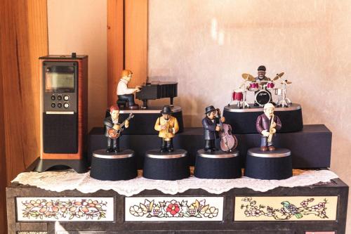 a group of figurines sitting on top of a table at Hanok Prince in Gyeongju
