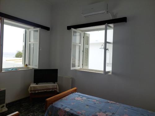 En eller flere senge i et værelse på Astypalaia Peyki