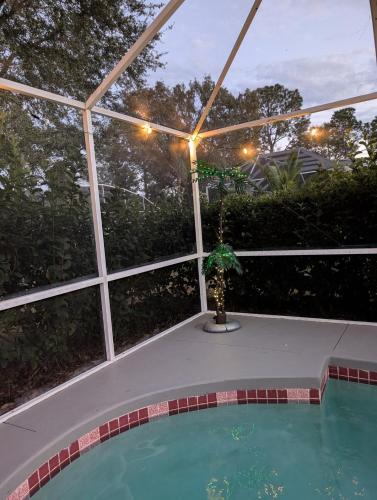 a view of a swimming pool in a building at Spacious home with heated pool in Palm Coast! in Palm Coast
