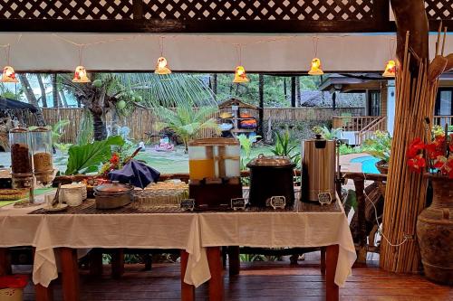 a table with pots and pans on top of it at White Villas Resort in Siquijor