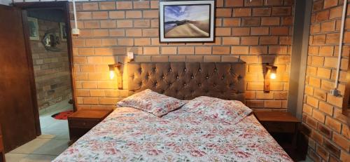 Postel nebo postele na pokoji v ubytování Chalé confortável para família.