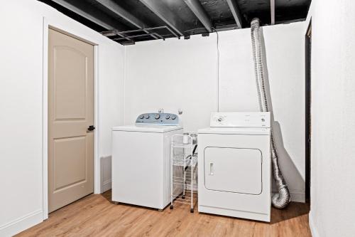 a kitchen with a washer and dryer in a room at Newly Renovated 3 Bedroom St. Peters MO Home in Cottleville