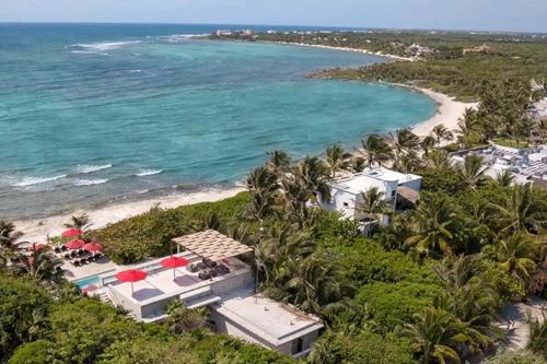 an aerial view of the beach and the ocean at Akumal Seabreeze Private Hot Tub Beach Access 11 Pools in Akumal