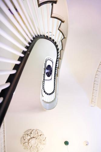 a staircase in a building with a spiral stair case at Charming & Stylish Studio on Beacon Hill #3 in Boston