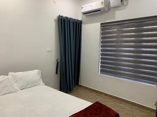 Ένα ή περισσότερα κρεβάτια σε δωμάτιο στο SONNET VILLA HOME Stay