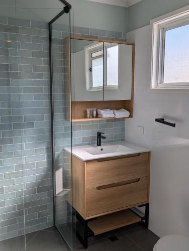a bathroom with a sink and a shower at Sails Lifestyle Resort in Peregian Beach