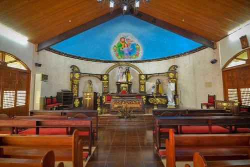 a large church with a large painting on the wall at Grand Villa Laguna in Manila