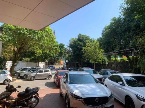 a bunch of cars parked in a parking lot at Crown Hotel in Thái Nguyên