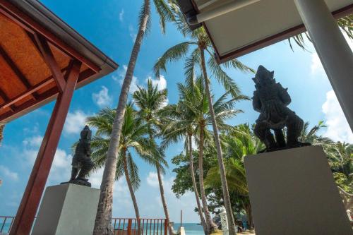 a view of the beach from a resort with palm trees at Crystal Bay Yacht Club Beach Resort in Lamai