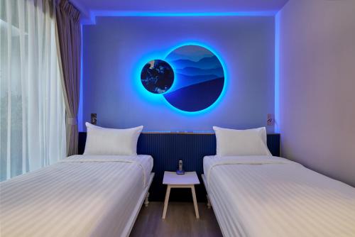 Ένα ή περισσότερα κρεβάτια σε δωμάτιο στο Riva Vibe Hotel Bangkok by PCL