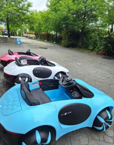 a group of motorcycles parked in a parking lot at Michelin Castle - Yilan Homestay in Wujie