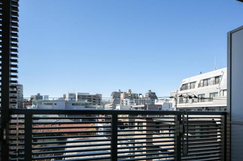 a view of a city from a balcony at Daffitto Mitaka in Mitaka