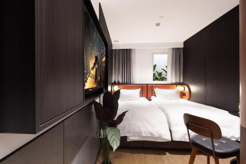 a bedroom with a large bed and a tv at Mcsrh Hotel-Chengdu Chunxi Road in Chengdu