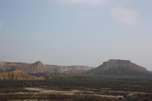 a view of a desert with mountains in the background at Apartamento Turistico Cigüeña de Arguedas in Arguedas