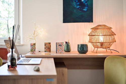 a table with a lamp on top of it at La Villa KEF in Lambesc