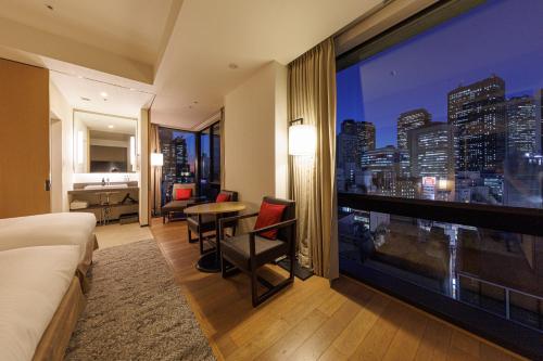 a hotel room with a view of a city at JR Kyushu Hotel Blossom Shinjuku in Tokyo