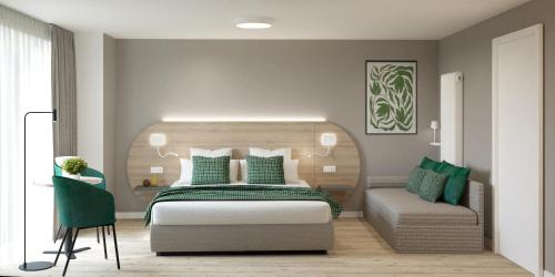 a bedroom with a bed and a chair at Hotel Venezia in Trento