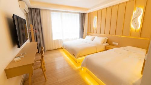 Postel nebo postele na pokoji v ubytování Yibuxuan Boutique Hotel Yangshuo