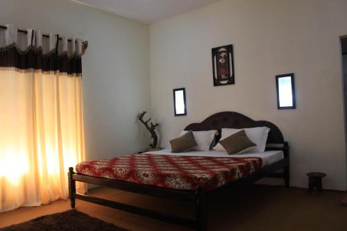Postel nebo postele na pokoji v ubytování Green Ark Resorts