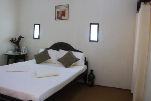 Postel nebo postele na pokoji v ubytování Green Ark Resorts