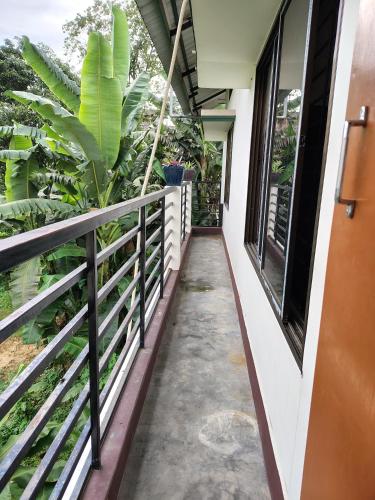 a walkway to the balcony of a house at Upasana Homestay in Dibrugarh