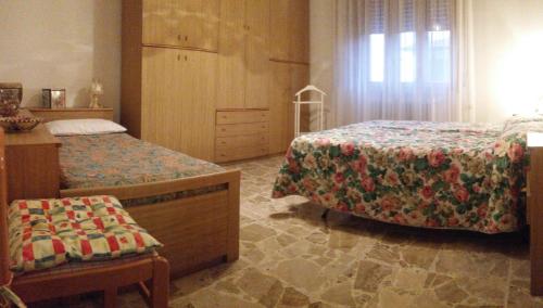 Кровать или кровати в номере Apartment Nonna Cucca