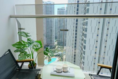a room with a table and a large window at Masterise Center Point 2BR in Gò Công