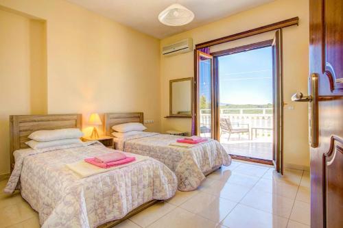 A bed or beds in a room at Zante View villa Athina